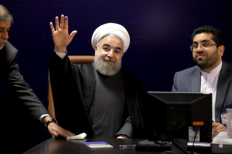 Iranian President Hassan Rouhani right and his Chinese counterpart Xi Jinping shake hands at the conclusion of their joint press conference at the Saadabad Palace in Tehran Iran