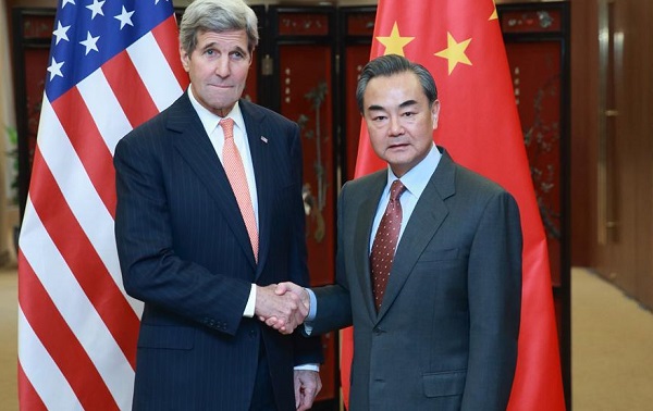 Chinese Foreign Minister Wang Yi shakes hands with U.S. Secretary of State John Kerry in Beijing capital of China Jan. 27 2016