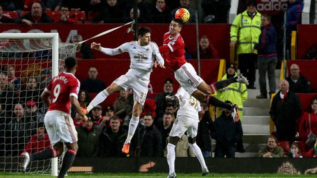 Chris Smalling wins a header in Manchester United's win over Swansea