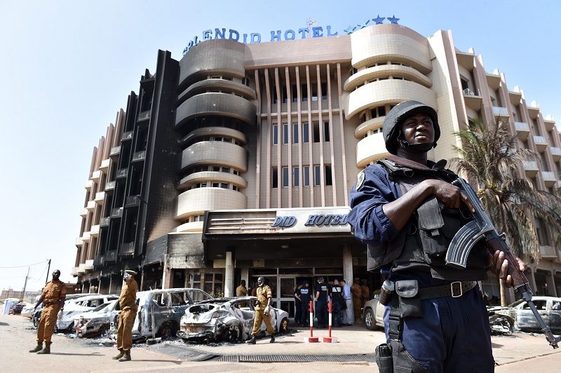 A policeman stands guard in front of the Splendid hotel in Ouagadougou Burkina Faso following a jihadist attack by al Qaeda linked gunmen a few days ago. – AFP pic