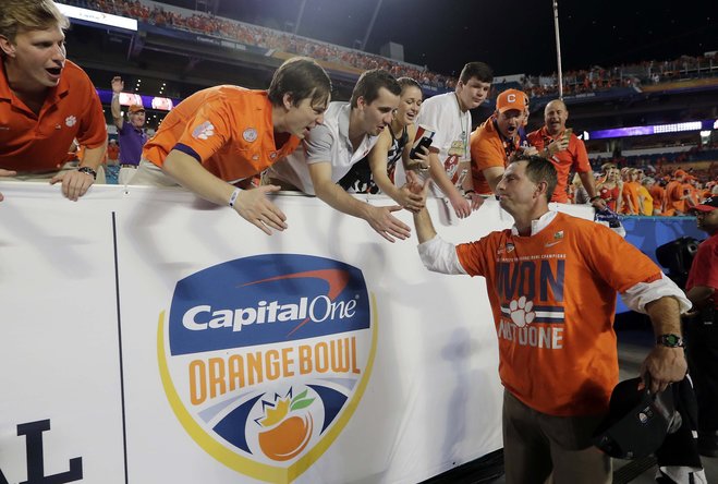 Clemson head coach Dabo Swinney greets fans after winning the Orange Bowl NCAA college football semifinal playoff game against Oklahoma Thursday Dec. 31 2015 in Miami Gardens Fla. Clemson defeated Oklahoma 37-17