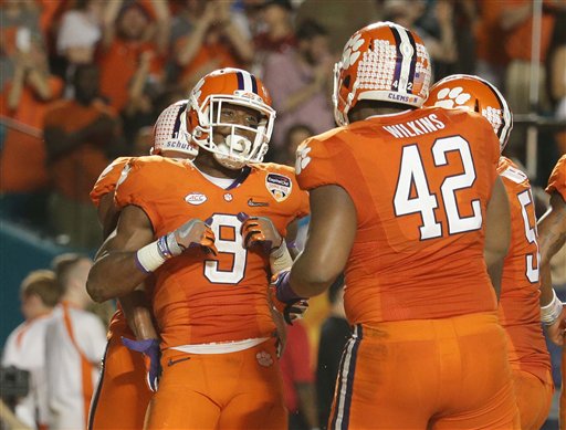 Clemson running back Wayne Gallman celebrates his touchdown with defensive lineman Christian Wilkins during the second half of the Orange Bowl NCAA college football semifinal playoff game against Oklahoma Thursday Dec. 31 2015 in Miami Garden