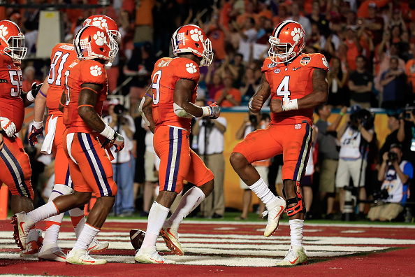 MIAMI GARDENS FL- DECEMBER 31 Wayne Gallman #9 of the Clemson Tigers celebrates with Deshaun Watson #4 after scoring a touchdown in the third quarter against the Oklahoma Sooners during the 2015 Capital One Orange Bowl at Sun Life Stadium on December