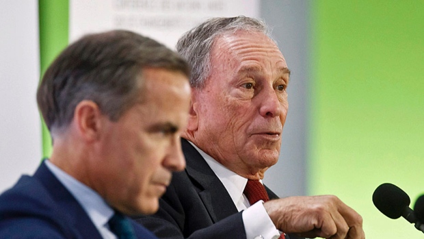 Former New York City mayor Michael Bloomberg right speaks during a panel discussion on'Climate Change and Financial Markets alongside Bank of England governor Mark Carney at the UN climate conference in Paris in December