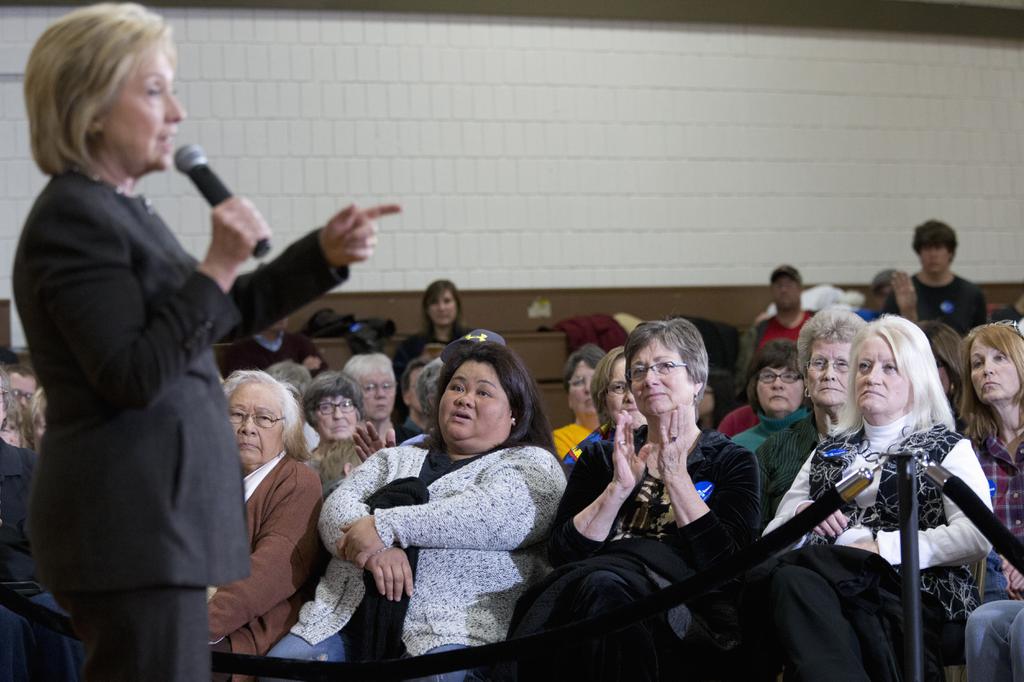 2016 supporters listen as Democratic presidential candidate Hillary Clinton speaks during a campaign event at the Knoxville School District Administration Office in Knoxville Iowa