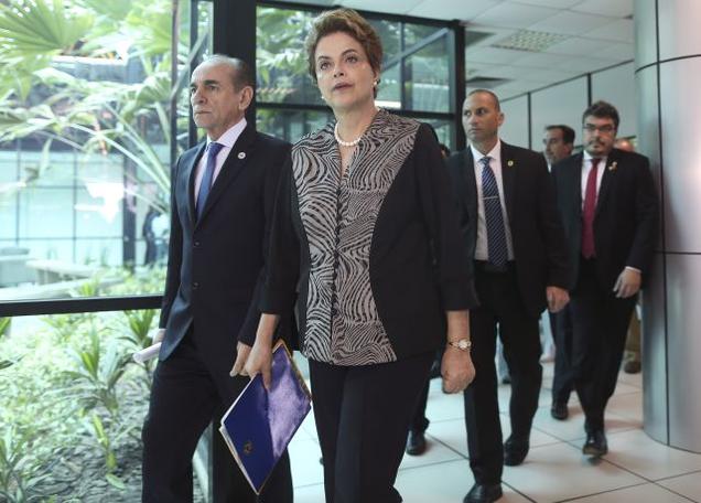 Brazil's President Dilma Rousseff and Health Minister Marcelo Castro during their visit to the National Center for Coordination and Control of Aedes aegypti mosquito in Brasilia Brazil on Friday.- Reuters