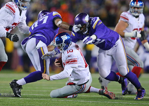 Vikings rip Giants 49-17 to clinch berth