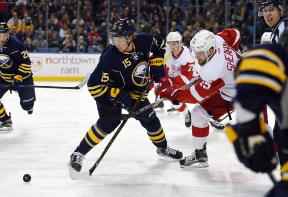 Buffalo Sabres center Jack Eichel battles for