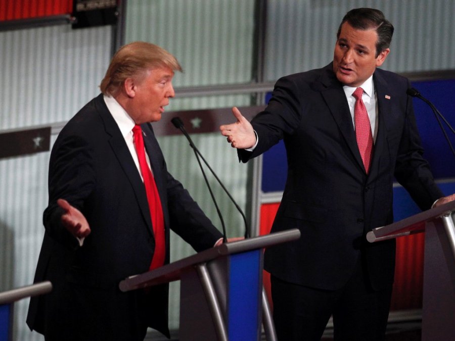 Republican US presidential candidate businessman Donald Trump and Senator Ted Cruz speak simultaneously at the Fox Business Network Republican presidential candidates debate in North Charleston South Carolina