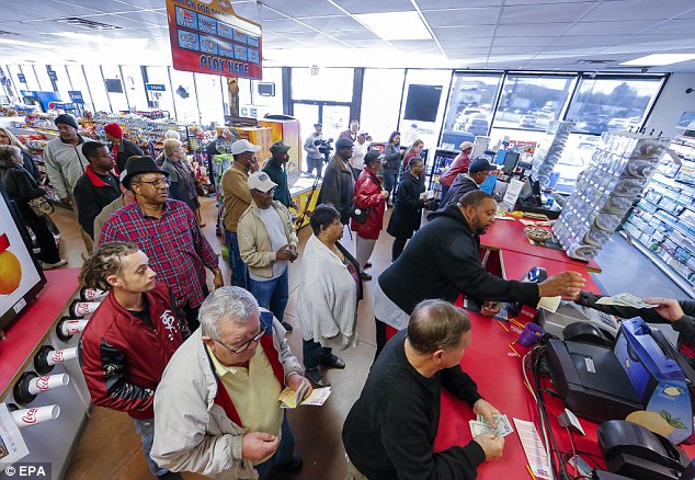 Customers wait in several long lines to purchase tickets for the multi-state Powerball lottery at Robinson's convenience store in Tallapoosa Georgia