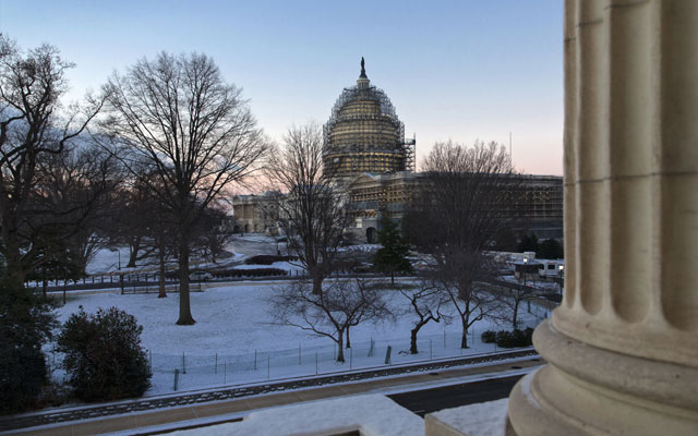 The Capitol in Washington Thursday morning Jan. 21 2016 after less than an inch of overnight snow created hazardous road conditions and major traffic delays. The Washington region could get up to two feet of snow along with strong winds and whiteout