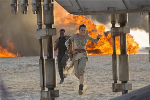 Daisy Ridley right as Rey and John Boyega as Finn in a scene from the film'Star Wars The Force Awakens