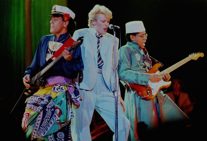 David Bowie performs in 1983 flanked by Carmine Rojas and Carlos Alomar