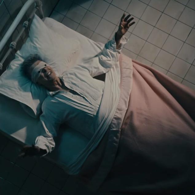 'Look up here I'm in heaven' David Bowie sings from his apparent death bed in the music video for'Lazarus