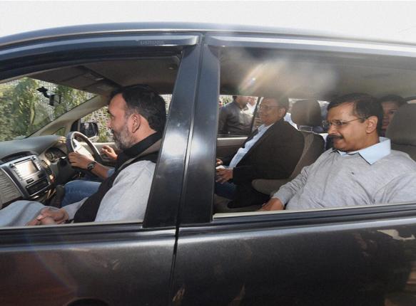 Delhi Chief Minister Arvind Kejriwal carpools with Transport Minister Gopal Rai and Health Minister Satyendra Jain to the Delhi Secretariat as the trial odd-even scheme came into effect in New Delhi on Friday. PTI