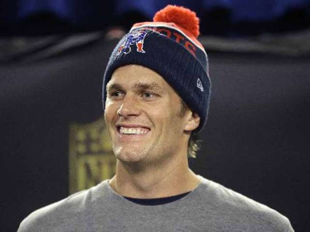 New England Patriots quarterback Tom Brady faces reporters before an NFL football practice Thursday Jan. 21 2016 in Foxborough Mass. The Patriots are to play the Denver Broncos in the AFC Championship on Sunday in Denver. AP