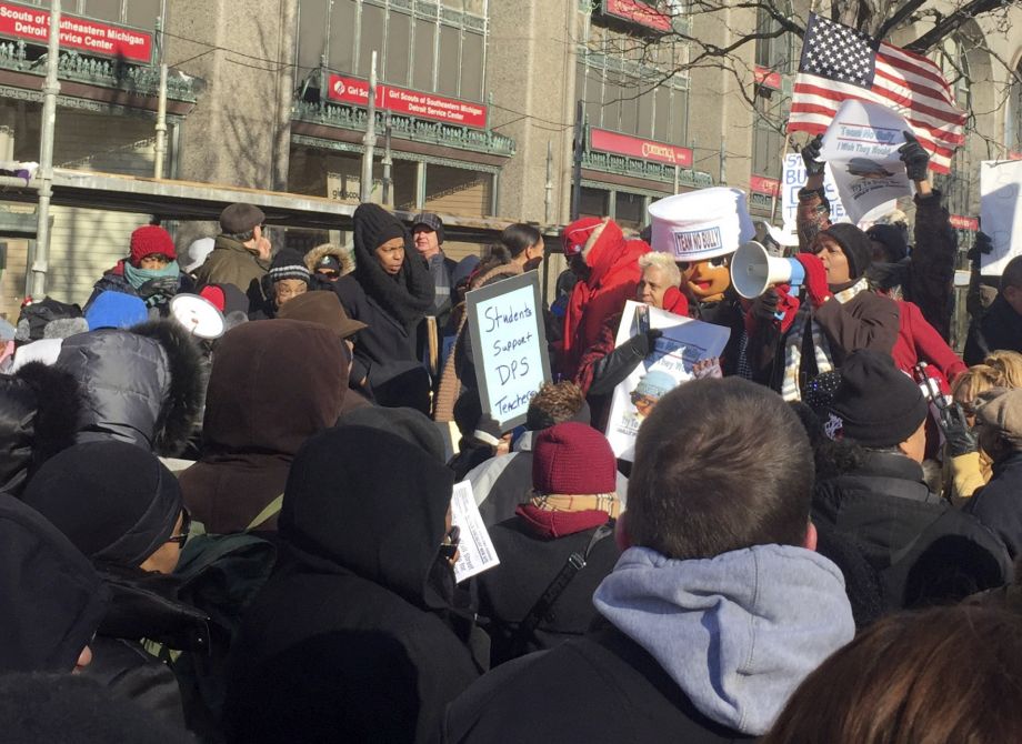 A group of over a hundred teachers joined by parents and children protest Monday Jan. 11 2016 in Detroit. A wave of teacher absences described by an activist