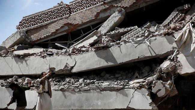 Men inspect the rubble of the Chamber of Trade and Industry headquarters in the Yemeni capital Sana’a after it was hit by a Saudi airstrike