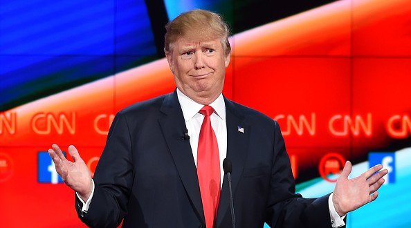 TOPSHOT- Republican presidential candidate businessman Donald Trump gestures during the Republican Presidential Debate hosted by CNN at The Venetian Las Vegas