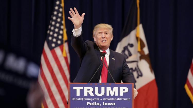 Republican presidential candidate Donald Trump greets guests before speaking at a campaign event in Pella Iowa