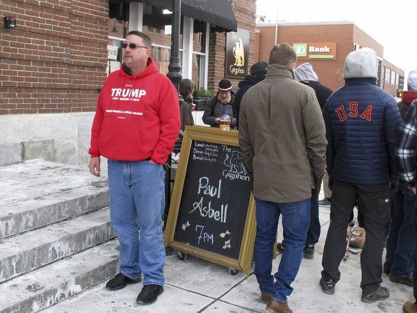 Michael Hart of Ausable N.Y. left stands near the front of the line at midday for the evening appearance of Republican presidential candidate Donald Trump Thursday Jan. 7 2016 in Burlington Vt. Trump is scheduled to hold a rally in the town where De