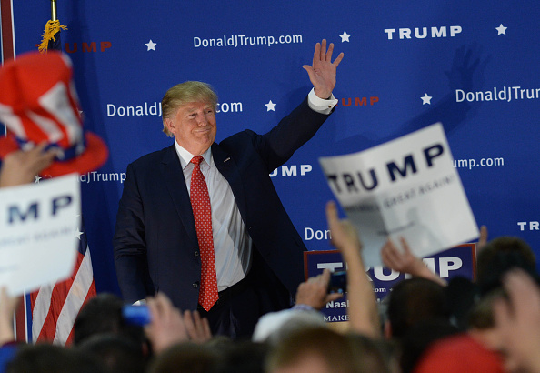 NASHUA NH- DECEMBER 28 Republican Presidential candidate Donald Trump waves to the crowd after speaking at a rally at Pennichuck Middle School