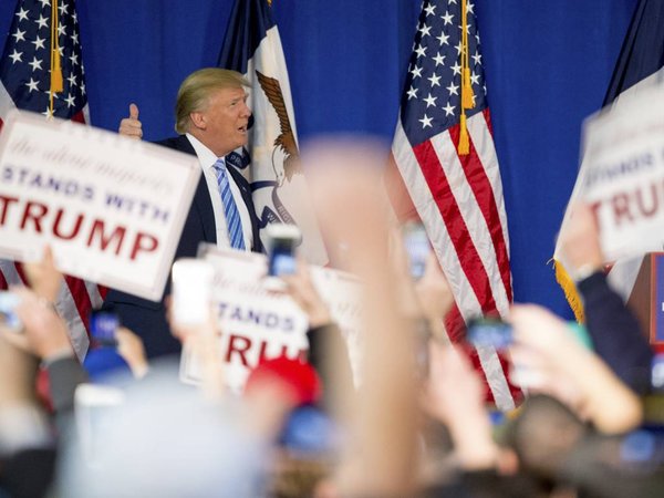 Republican presidential candidate Donald Trump arrives to speak at a rally at Muscatine High School in Muscatine Iowa Sunday Jan. 24 2016