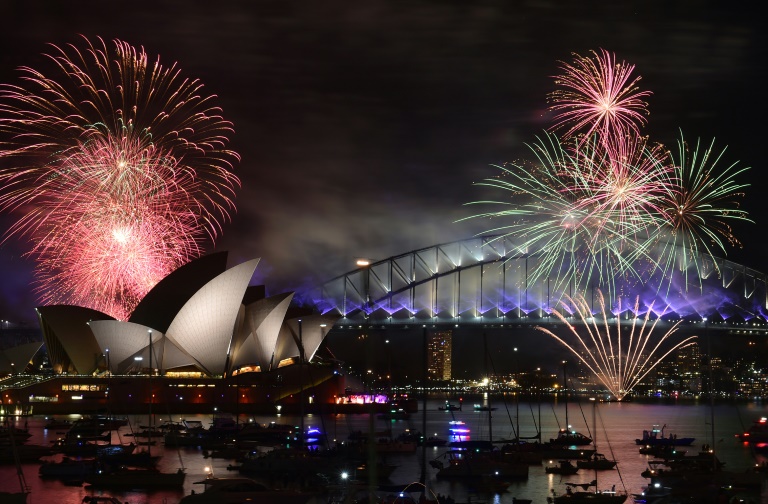 AFP  Saeed Khan Fireworks light up the sky over Sydney's Opera House and Harbour Bridge during New Year celebrations in Sydney