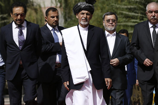 Newly-elected Afghan President Ashraf Ghani Ahmadzai center arrives for an inauguration ceremony at the presidential palace in Kabul Afghanistan Monday Sept. 29 2014. Omar Sobhani  AP