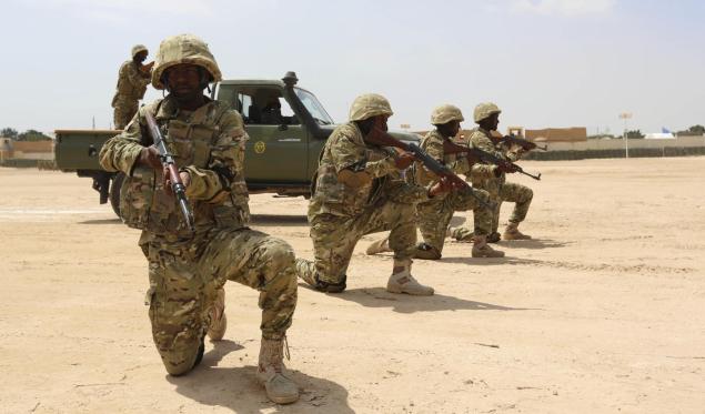 Members of the Somali military shown here are reportedly battling Islamic extremists that attacked a Mogadishu beach Thursday