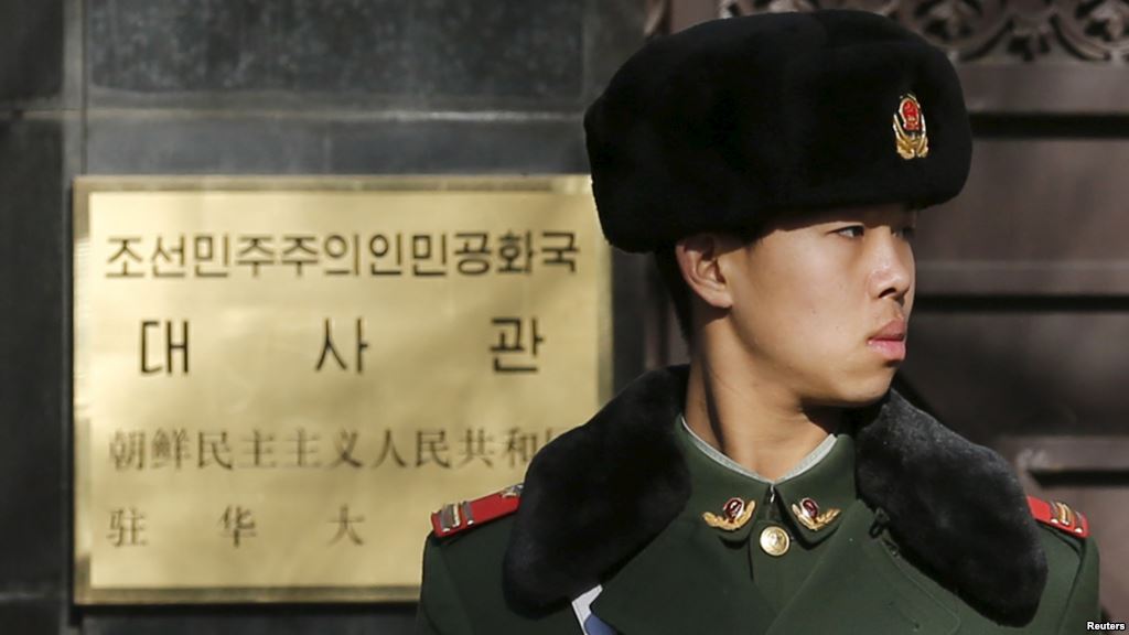 FILE- A paramilitary soldier stands guard at the main gate of North Korea's embassy in Beijing Jan. 6 2016