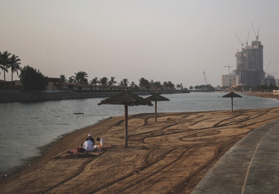 Families relax by the Jiddah corniche during sunset in Saudi Arabia