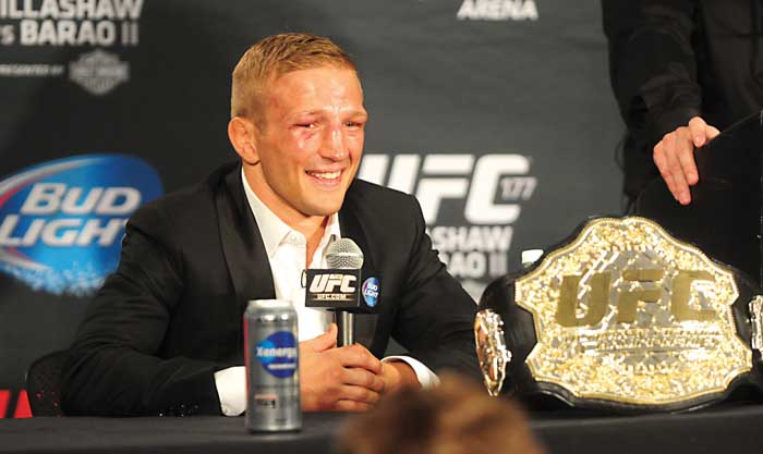 Angels Camp native TJ Dillashaw is all smiles after defending his UFC bantamweight title Aug. 30 2014