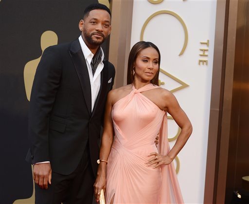 Will Smith left and Jada Pinkett Smith arrive at the Oscars at the Dolby Theatre in Los Angeles. Smith said Thursday Jan. 21 2016 he will not attend the Academy Awards next month joining his wife Jada Pinkett Smit