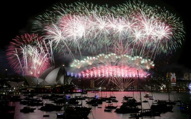 Fireworks explode over the Sydney Opera House and Harbour Bridge as Australia's largest city ushers in the New Year