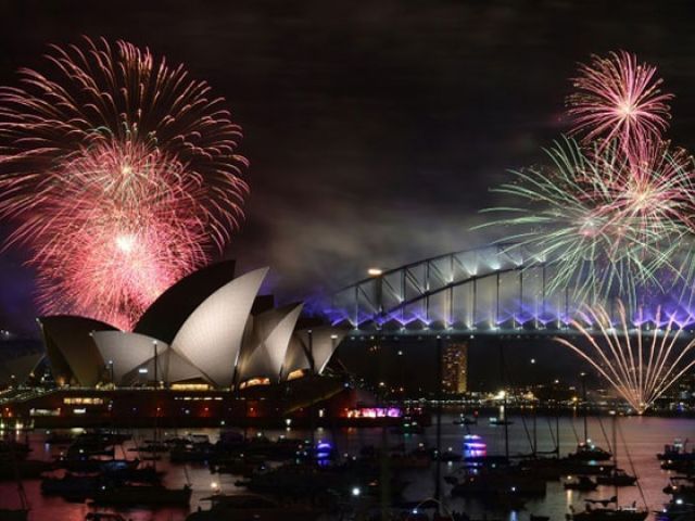 Fireworks light up the sky over Sydney's Opera House and Harbour Bridge during New Year celebrations in Sydney