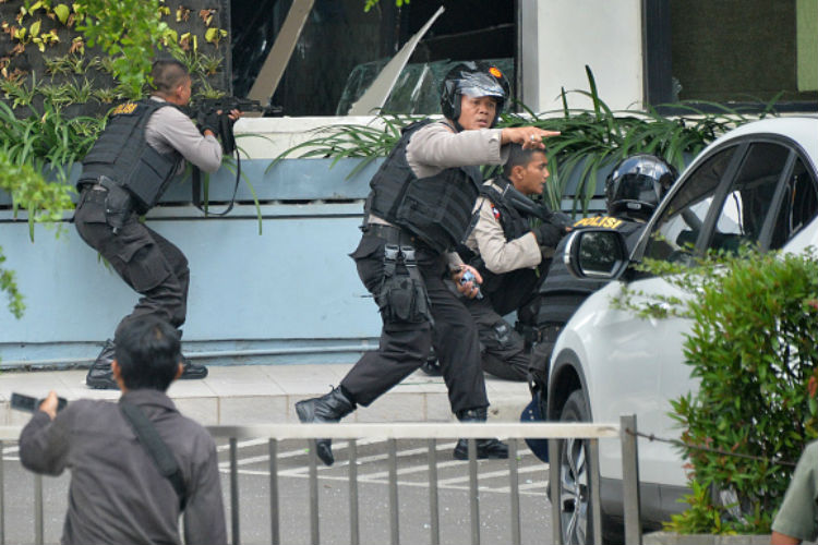 Five suspected terrorists launched an assault copying'the pattern of the Paris attacks as they detonated explosives and shot at people in Jakarta