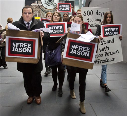 Ali Rezaian far left the brother of Washington Post reporter Jason Rezaian rallies with supporters to deliver a petition of 500,000 signatures to Iran's United Nations mission asking for the release of his