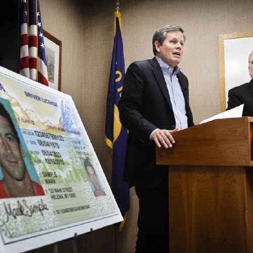 Daines R-Mont. joined by Montana Attorney General Tim Fox right discusses Montana's noncompliance with the federal REAL ID Act during a press conference showing the state's new driver's license at the attorney general