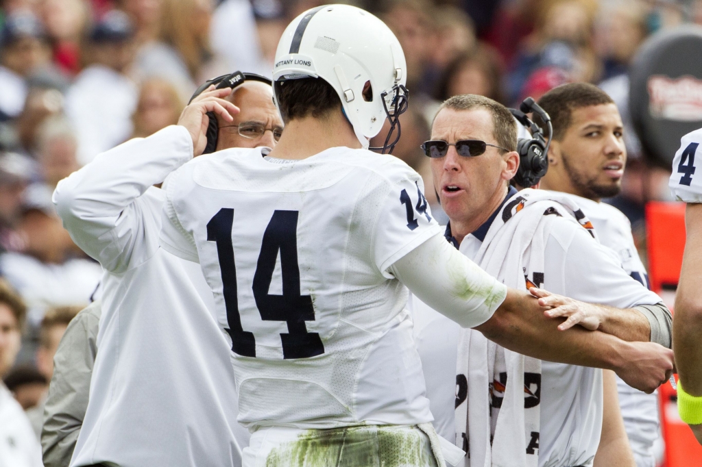 TaxSlayer Bowl Football Penn State head coach James Franklin left and athletic trainer Tim Bream check on injured quarterback Christian Hackenberg prior to his leaving the game in the first half