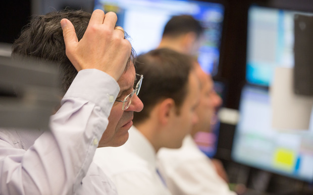 German stock traders watch as the market is rattle by Chinese volatility