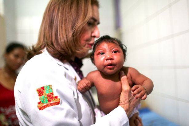 Dr. Angela Rocha examines Ludmilla Hadassa Dias de Vasconcelos