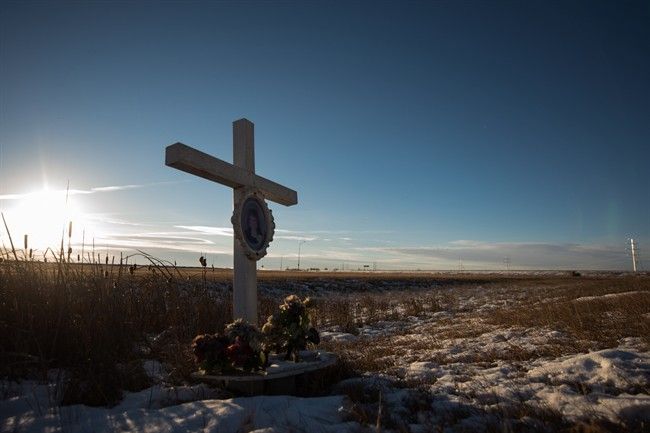 A memorial to a previous crash marks the intersection at Wanuskewin Rd and Highway 11 outside of Saskatoon Saskatchewan. The intersection was the scene of tragedy where a family of four were killed in a collision with an SUV Sunday morning. Catherine Lo