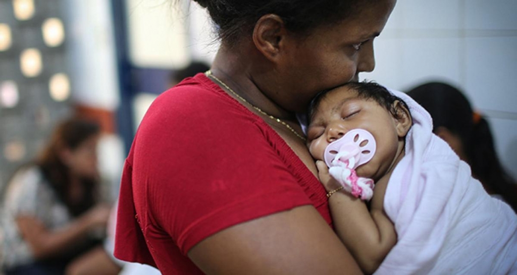 Grandmother Ivalda Caetano holds stricken baby Pic Getty