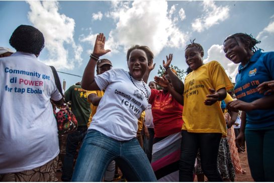 Women celebrate in the city of Freetown Sierra Leone on Nov. 7 after the World Health Organization declared their country Ebola free