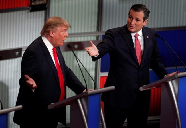 Republican US presidential candidate businessman Donald Trump and Senator Ted Cruz speaking simultaneously at the Fox Business Network Republican presidential candidates debate in North Charleston South Carolina today