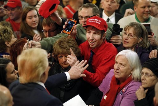 People greet Republican presidential candidate Donald Trump bottom left after he spoke at a rally at the Surf Ballroom in Clear Lake Iowa Saturday Jan. 9 2016