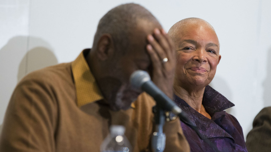 Camille Cosby right looks on as Bill Cosby speaks during a news