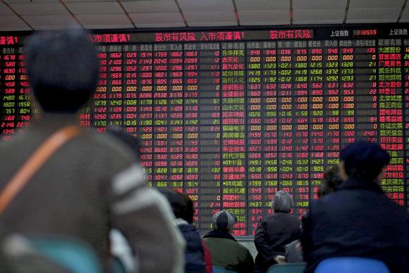 Investors watch the Shanghai stock market Friday.																						
		
		
																			
				Close