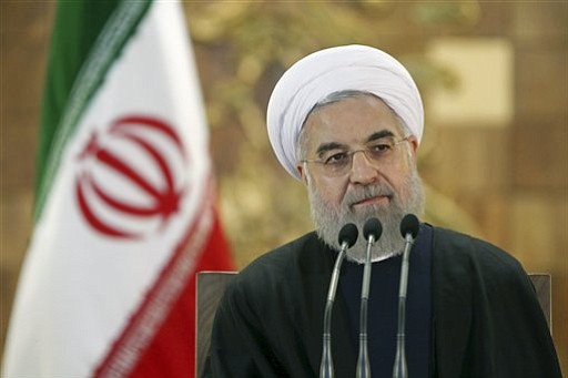 Iranian President Hassan Rouhani attends a news conference in Tehran Iran Sunday Jan. 17 2016. The implementation of a historic nuclear deal with world powers is expected to pave the way for a new economic reality in Iran now freed from harsh interna